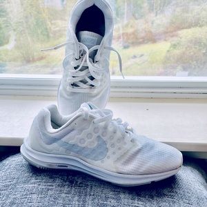 White Nike athletic shoes